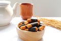 Crispy rice cakes wrapped in seaweed in a wooden bowl. Nori maki rice crackers. Royalty Free Stock Photo