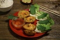 Crispy rice pancakes with prawns, Vietnamese mint leaves or banh khot, khot cake