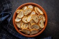 Crispy roasted bruschetta bread in bowl on black table. Top view Royalty Free Stock Photo