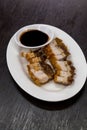 Crispy roasted pork belly meat served with black sweet soy sauce Royalty Free Stock Photo