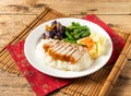 Crispy Roasted Pork Rice with green chili in white plate on mat isolated on wooden background top view chinese rice Royalty Free Stock Photo