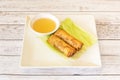 Crispy rolls stuffed with fried fish with sauce for dipping Royalty Free Stock Photo