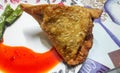 Crispy samosa garnished with red chutney and chillies Royalty Free Stock Photo