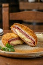 Crispy San Jacobo or Cordon Bleu: Breaded steak stuffed with ham and melting cheese Royalty Free Stock Photo