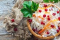 Crispy sauerkraut with cranberries in a wooden bowl. Royalty Free Stock Photo