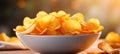 Crispy and savory potato chips on a defocused background with ample copy space for text placement