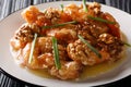 Crispy shrimp tossed in a creamy sweet sauce and candied walnuts close-up. horizontal Royalty Free Stock Photo