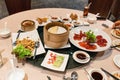 Crispy skin duck with soy sauce, flour sheet, fried tofu on round table in chinese restaurant Royalty Free Stock Photo