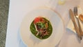 Crispy Skin Halibut, Purple Asparagus, Pickled Radish & an Infused Mint Pea Nage with Beta-Pinene Royalty Free Stock Photo