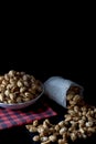 Crispy Sugared peanuts in Sack and white cup Royalty Free Stock Photo