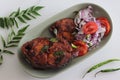 Crispy Surmai fish fry. Shallow fried king fish in Kerala style served with Onion tomato salad called challas