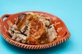 crispy tasty baked piglet in ceramic dish