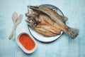 Crispy Thai style deep fried whole sea bass fish served with spicy sauce Royalty Free Stock Photo