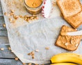 Crispy toast with peanut butter, bananas, breakfast, top view