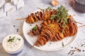 Crispy tornado potatoes. Potato chips on skewers, roasted with thyme and spices