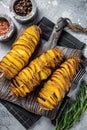 Crispy Tornado or twist potatoes chips on wooden board. Gray background. Top view