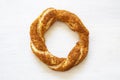 Crispy Turkish traditional bagel / simit with sesame on wooden rustic background