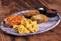 Crispy vegetable meatballs on a plate. Yummy patties made of potatoes, green peas, carrot and green beans and garnished with fresh Royalty Free Stock Photo