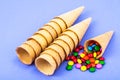 Crispy waffle cones with colorful candies Royalty Free Stock Photo