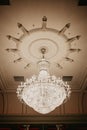 Cristal chandelier close-up. Beautiful banquet hall under a tent for a wedding reception. Interior of a wedding tent. Decoration Royalty Free Stock Photo