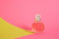 cristal glass perfume bottle on pink background Royalty Free Stock Photo