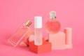 cristal glass perfume bottles and podiums on pink background copy space Royalty Free Stock Photo