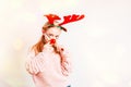 Little girl having fun wearing Christmas party glasses with reindeer antlers and red nose.Little girl in a Christmas Royalty Free Stock Photo