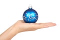 Cristmas decoration, glass blue ball in hand isolated on white background. New Year object Royalty Free Stock Photo