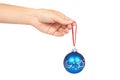 Cristmas decoration, glass blue ball in hand isolated on white background. New Year object Royalty Free Stock Photo