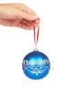 Cristmas decoration, glass blue ball in hand isolated on white background. New Year object Royalty Free Stock Photo