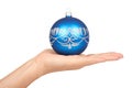 Cristmas decoration, glass blue ball in hand isolated on white background. New Year object Royalty Free Stock Photo