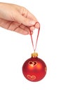 Cristmas decoration, glass red ball in hand isolated on white background. New Year object Royalty Free Stock Photo