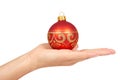 Cristmas decoration, glass red ball in hand isolated on white background. New Year object Royalty Free Stock Photo