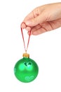 Cristmas decoration, glass red ball in hand isolated on white background. New Year object Royalty Free Stock Photo