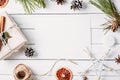 Cristmas decoration wirh gift box, pine cones, dried oranges on a white background. Top view, flat lay, mockup Royalty Free Stock Photo