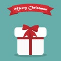 Cristmas gift with shadow and ribbon in a flat design