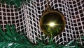 Cristmas ball decoration on a meshy curtain with fir twigs