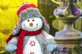 Cristmas soft toy of a snowman in a sweater, red scarf and hat Royalty Free Stock Photo