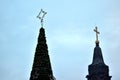 Cristmas tree with a church in the background Royalty Free Stock Photo