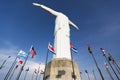 Cristo del Rey statue of Cali with world flags and blue sky, Col Royalty Free Stock Photo
