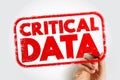CRITICAL DATA stamp held by a hand, showing a bold message in a textured stamp style, emphasizing urgency and importance for Royalty Free Stock Photo