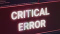Critical error message flashing on screen with hacking alert Royalty Free Stock Photo