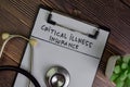 Critical Illness Insurance write on a paperwork isolated on Wooden Table Royalty Free Stock Photo