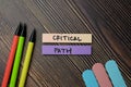 Critical Path write on sticky notes isolated on office desk