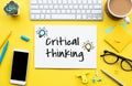 Critical thinking concepts with text on worktable