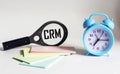 CRM, customer relationship management, loyalty program, repeat purchase frequency concept, CRM abreveatura magnifier Royalty Free Stock Photo