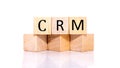 CRM, cube wooden block with alphabet combine the word abbreviation CRM on white background. Royalty Free Stock Photo