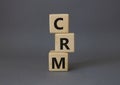 CRM - Customer relationship management symbol. Concept word CRM on wooden cubes. Beautiful grey background. Business and CRM Royalty Free Stock Photo