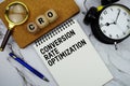 CRO Conversion Rate Optimization text written on notepad with magnifying glass and alarm clock on marble background Royalty Free Stock Photo