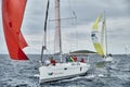 Croatia, Adriatic Sea, 19 September 2019: The race of sailboats, the team sits on the edge of a boat board, team work